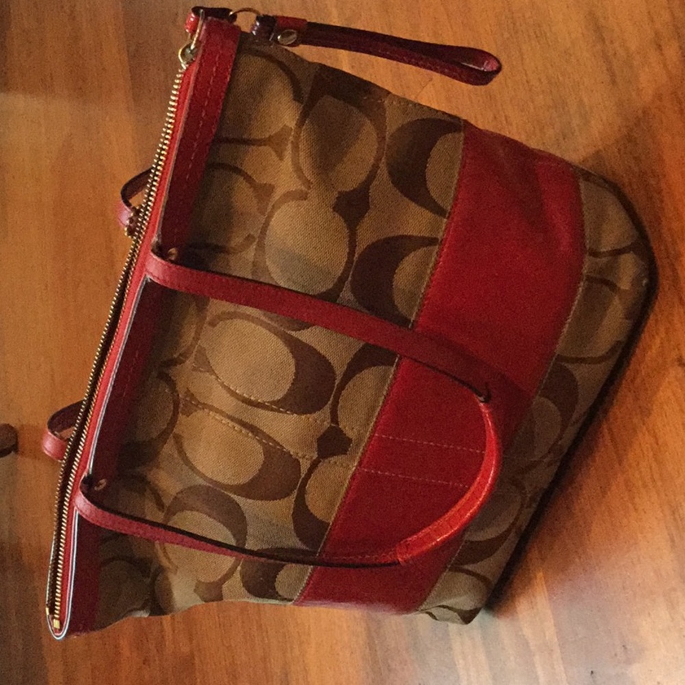 Coach shoulder bag. Red accents